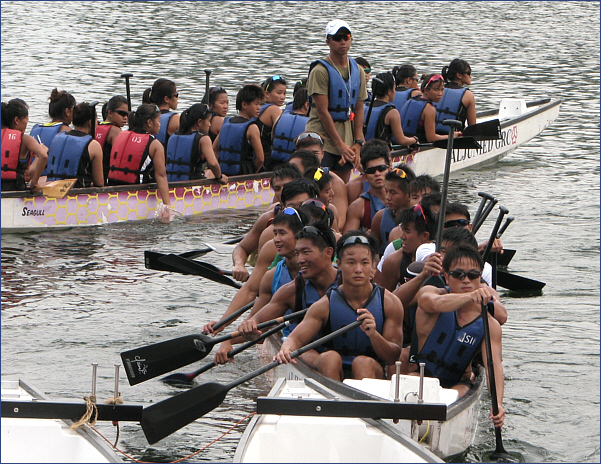 Students of the Singapore Institute of Management rowing during a Dragonboat competition in 2012